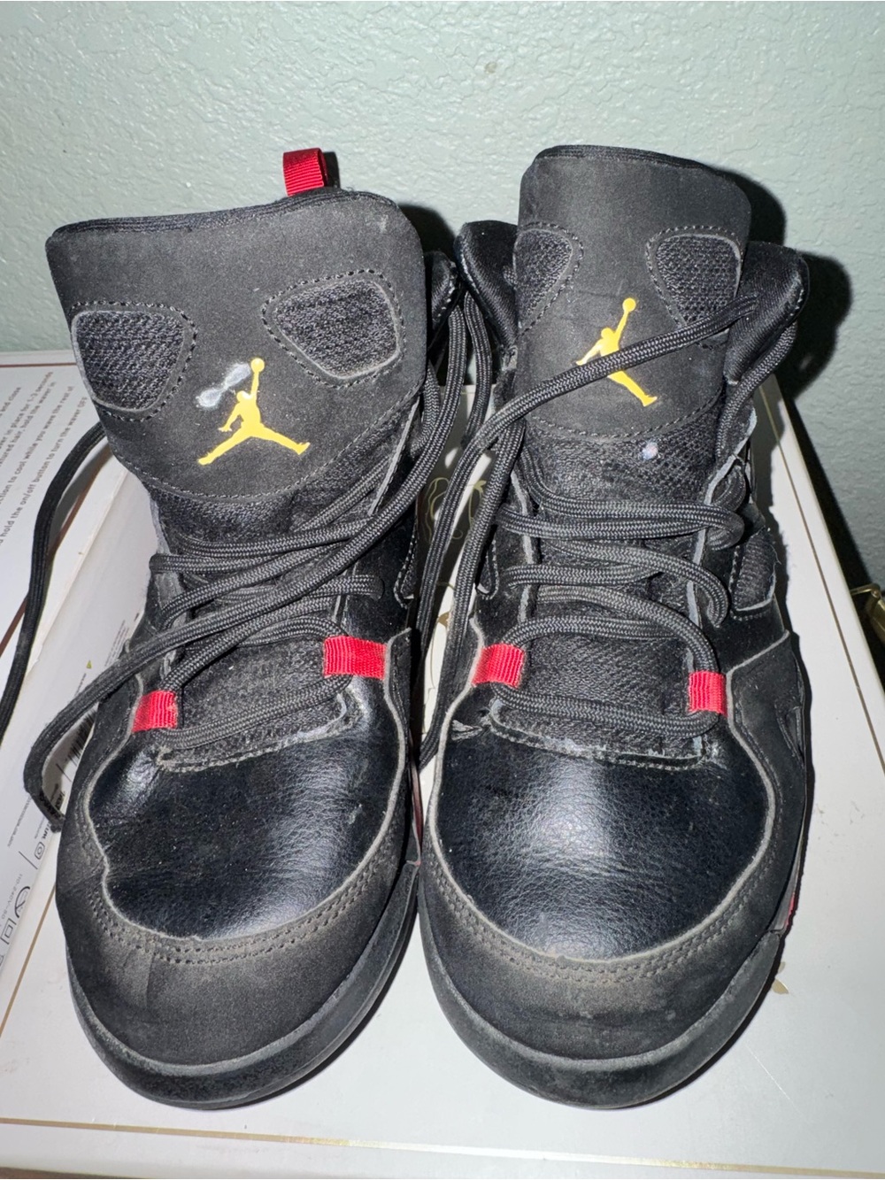 Jordan Kids Black Sneakers with Red and Gold Accents